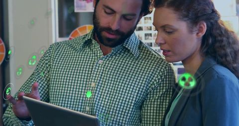 Diverse Colleagues Using Tablet with Digital Ecology Icons