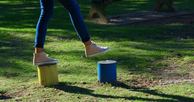 Person Balancing on Colorful Park Stumps - Download Free Stock Images Pikwizard.com