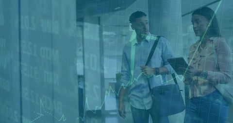 Colleagues Analyzing Financial Data Overlay in Vibrant Office Environment