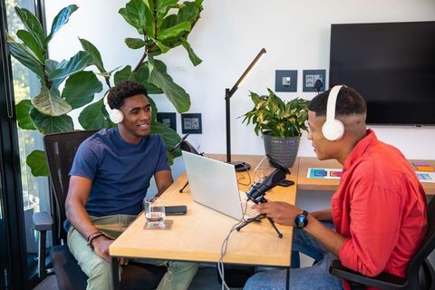Young Professionals Recording Podcast in Modern Office Studio