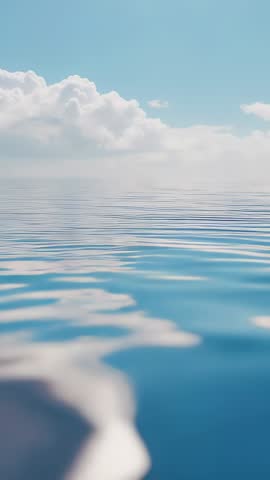 Vertical video showing breeze nudging calm sea surface, ripples and sun glints on horizon
