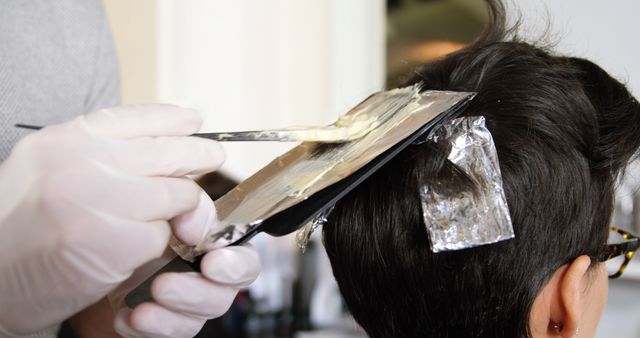 Hairdresser Applying Bleach on Client's Hair in Salon - Download Free Stock Images Pikwizard.com