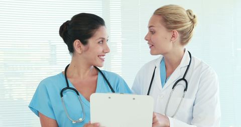 Healthcare Professionals Collaborating with Patient Chart - Download Free Stock Images Pikwizard.com