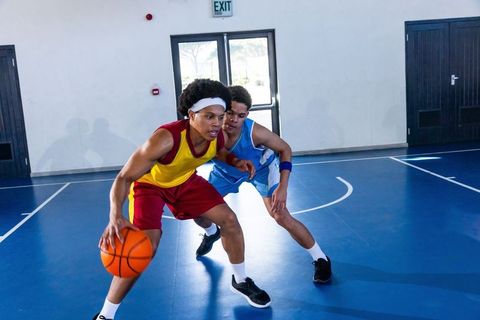 Basketball players in action during intense game