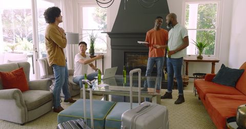 Friends Socializing in Cozy Living Room with Technology