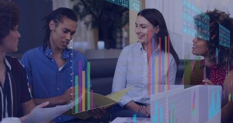 Young team collaborating with augmented reality charts and data overlays in office lounge