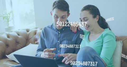 Couple Using Laptop with Overlay of Changing Numbers - Download Free Stock Images Pikwizard.com