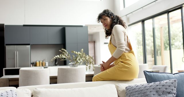 Woman Reflecting in Modern Kitchen with Natural Light Entering - Download Free Stock Images Pikwizard.com