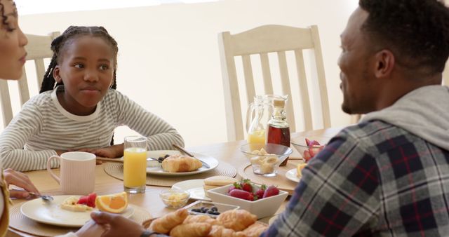 Smiling Family Enjoying Breakfast Together at Home - Download Free Stock Images Pikwizard.com