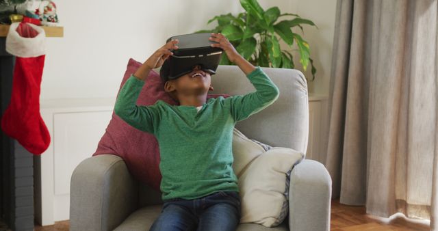 Excited Boy Experiencing Virtual Reality at Home During Holiday Season - Download Free Stock Images Pikwizard.com