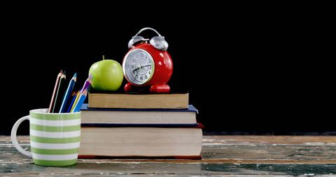 Vintage Alarm Clock and Books with Apple on Desk - Download Free Stock Images Pikwizard.com