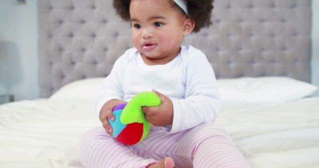 Cute Baby Playing with Colorful Toy in Bedroom - Download Free Stock Images Pikwizard.com