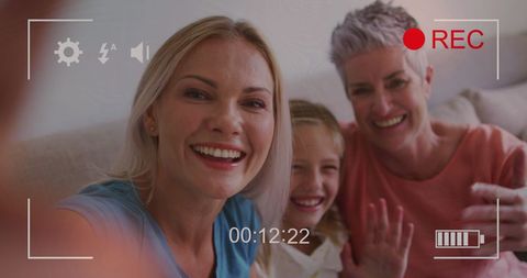Caucasian Family Smiling While Taking a Loving Selfie