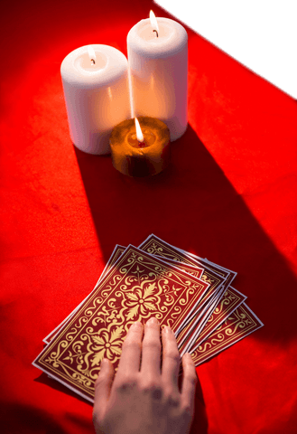 Fortune Teller Reading Tarot Cards with Candles on Red - Download Free Stock Videos Pikwizard.com