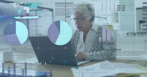 Senior woman working on laptop at home analyzing data dashboards and financial charts