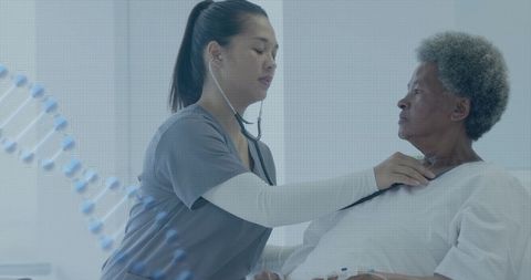 Diverse Female Doctor Examines Senior Patient in Hospital Room