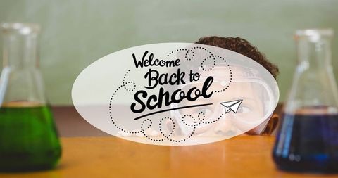 Creative back to school concept with beakers and young student