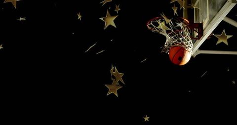 Basketball Swishing Through Hoop with Floating Gold Stars