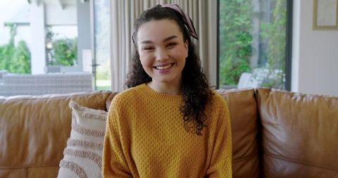 Smiling Woman in Cozy Living Room with Modern Decor