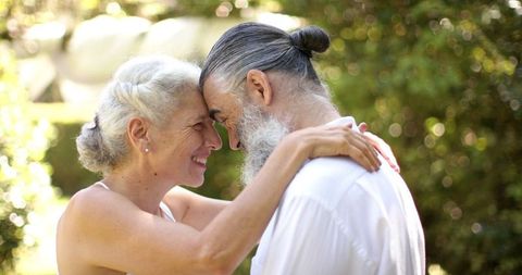 Senior Couple Embracing Outdoors at Sunset Wedding - Download Free Stock Images Pikwizard.com
