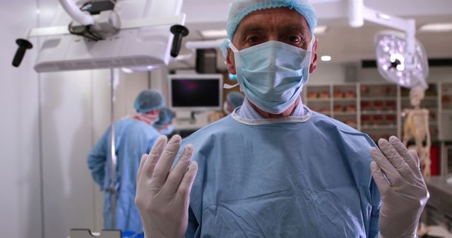 Surgeon Preparing for Operation in Modern Surgical Room - Download Free Stock Images Pikwizard.com