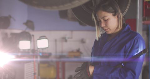 Caucasian Female Mechanic Fixing Vehicle in Workshop Garage - Download Free Stock Images Pikwizard.com