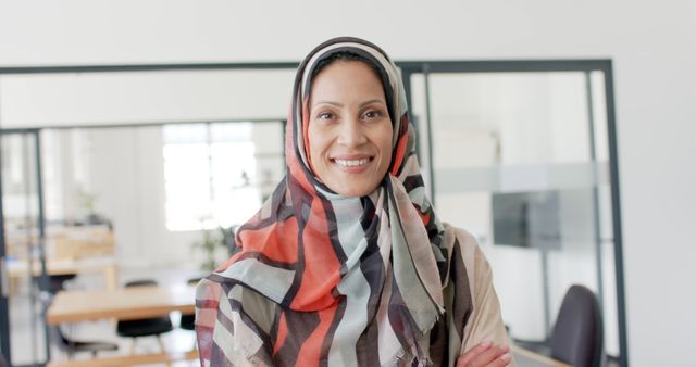 Confident Muslim Businesswoman Smiling in Modern Office - Download Free Stock Images Pikwizard.com