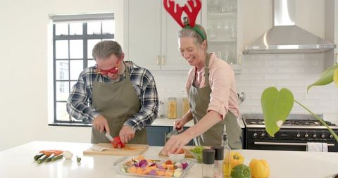 Senior Couple Celebrating Holiday Spirit Cooking Together