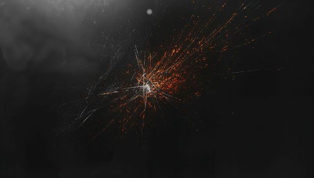 Fiery energy burst with sparks in dark void