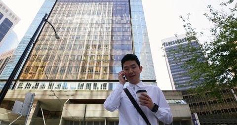 Young Professional Having Phone Call in Urban Business District