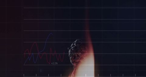 Burning ember glowing with flame beside abstract red and blue data chart overlay