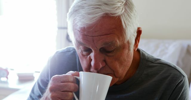 Elderly Man Enjoying Hot Beverage at Home - Download Free Stock Images Pikwizard.com