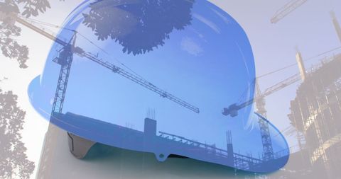 Construction safety helmet with building site and cranes overlay