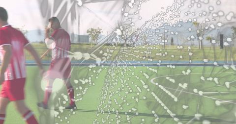 Red Team Soccer Players Running on Synthetic Turf with Droplet Motion Overlay