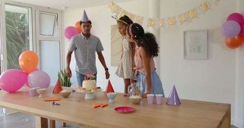 Family Birthday Celebration at Home with Cake and Decorations