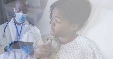 Doctor Consulting Young Patient in Hospital During Pandemic