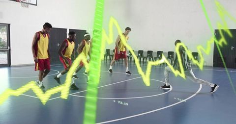Indoor basketball team running defensive drill with neon analytics overlay for coaching