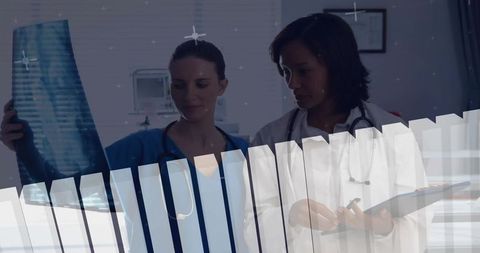 Doctors Examining X-Ray Film in Modern Clinic Room