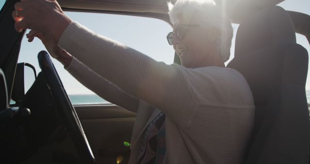 Senior Woman Driving Convertible Car by Beach on Sunny Day - Download Free Stock Images Pikwizard.com