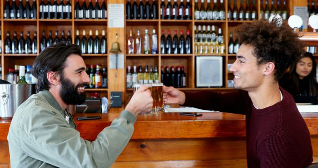 Two Friends Enjoying Drinks at Bar with Shelves of Bottles in Background - Download Free Stock Images Pikwizard.com