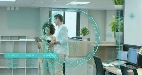 Colleagues Discuss Strategy with Digital HUD Interface in Modern Office