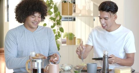 Two Friends Enjoying Casual Meal Together