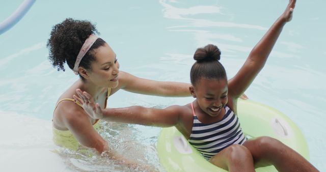 Mother and Daughter Enjoying Fun Pool Time with Inflatable Ring - Download Free Stock Images Pikwizard.com