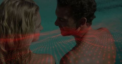 Romantic Couple with Digital Dot Grid Overlay in Pool