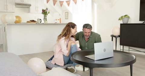 Mature Couple Video Chatting in Cozy Living Room