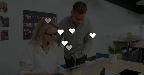 Colleagues Discussing Project in Contemporary Office Setting