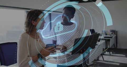 Collaborators discussing cloud security technology in modern office