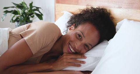 Cozy Morning Relaxation with Comfortable Bedding and Natural Decor