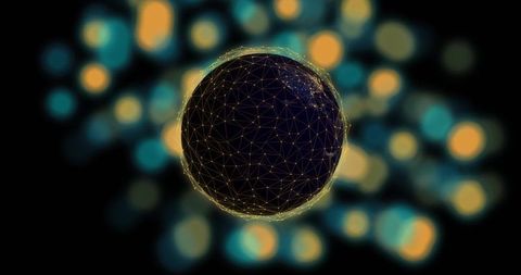 Glowing wireframe orb floating in dark space with golden mesh and teal-yellow bokeh halo
