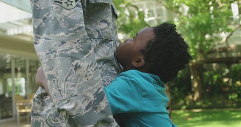 Emotional Homecoming: Soldier Embraces His Young Son - Download Free Stock Images Pikwizard.com